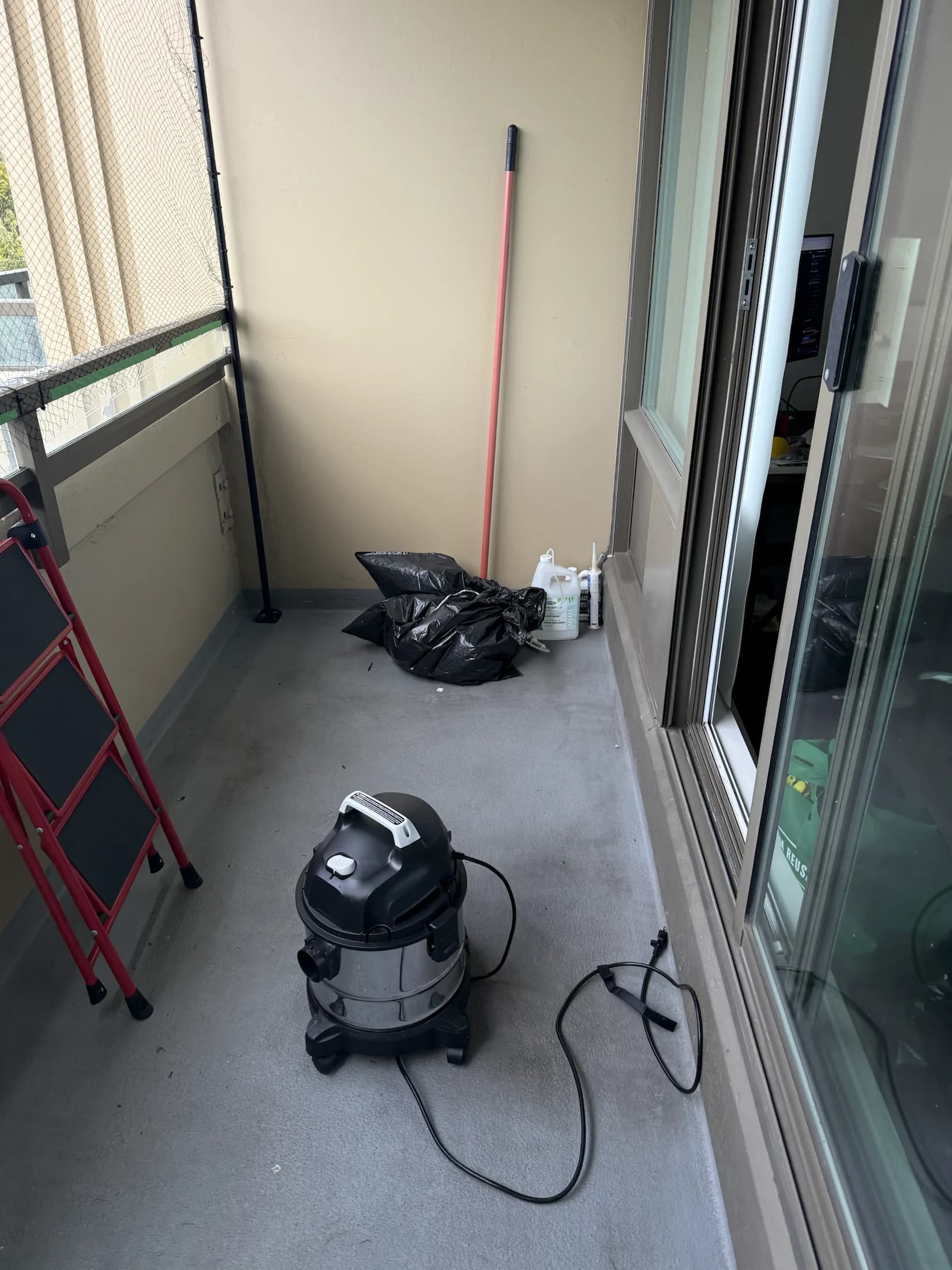 Cleanup vacuum and equipment organized on the balcony
