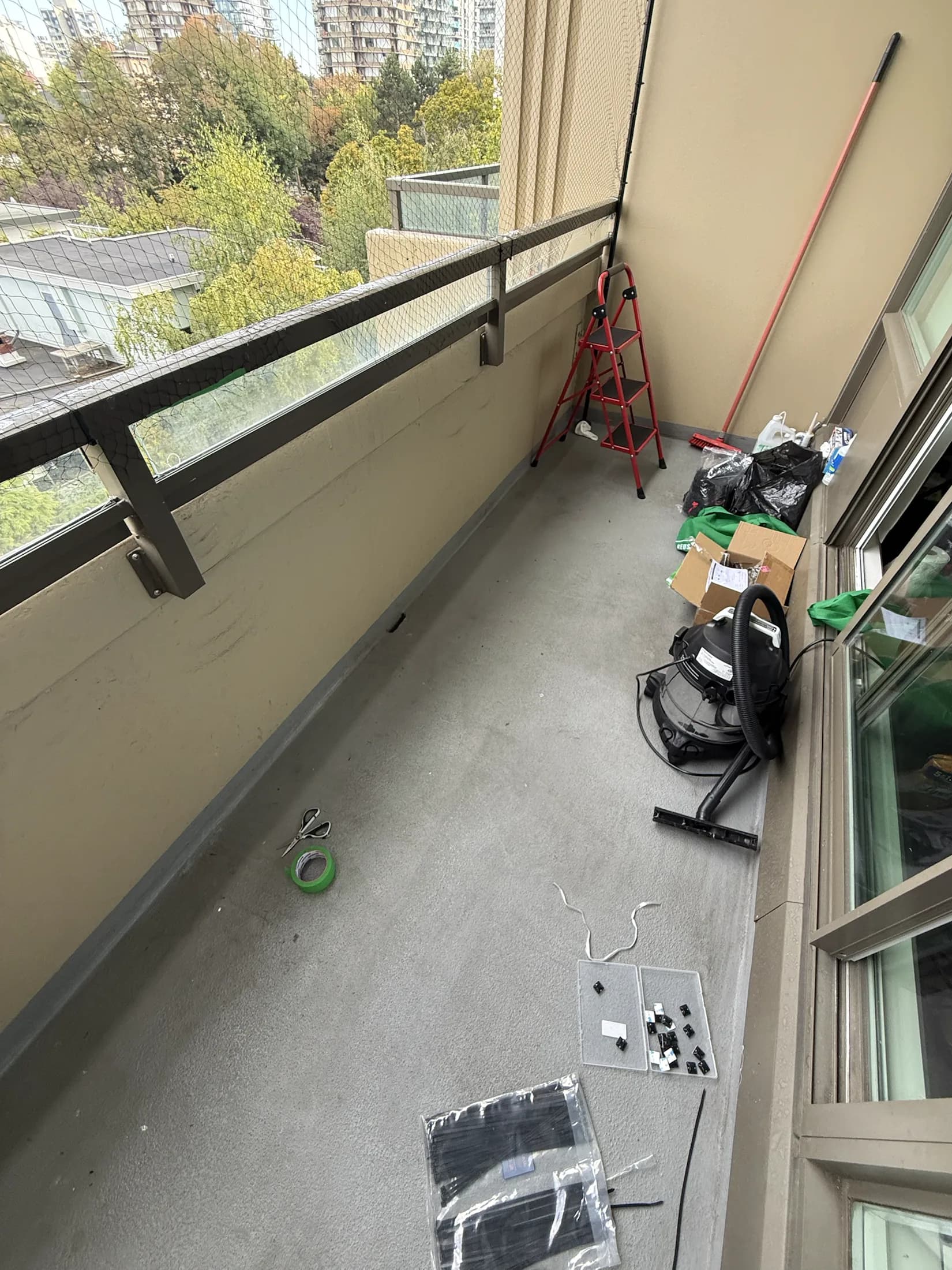 Wide view of equipment used for a balcony bird-netting installation